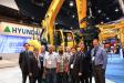 M.S. Kang (third from R), president of Hyundai Construction Equipment Americas, welcomes executives from Heavy Equipment Rental & Sales (HES) and its parent company, the Porter Group, to celebrate HES’s purchase of eight Hyundai excavator models on display there. (L-R): J.Y. Moon, D.S. Kim, Darren Ralph, Robin Porter, Kent Porter, Simon Porter, M.S Kang, Hayden Porter, and Corey Rogers.
